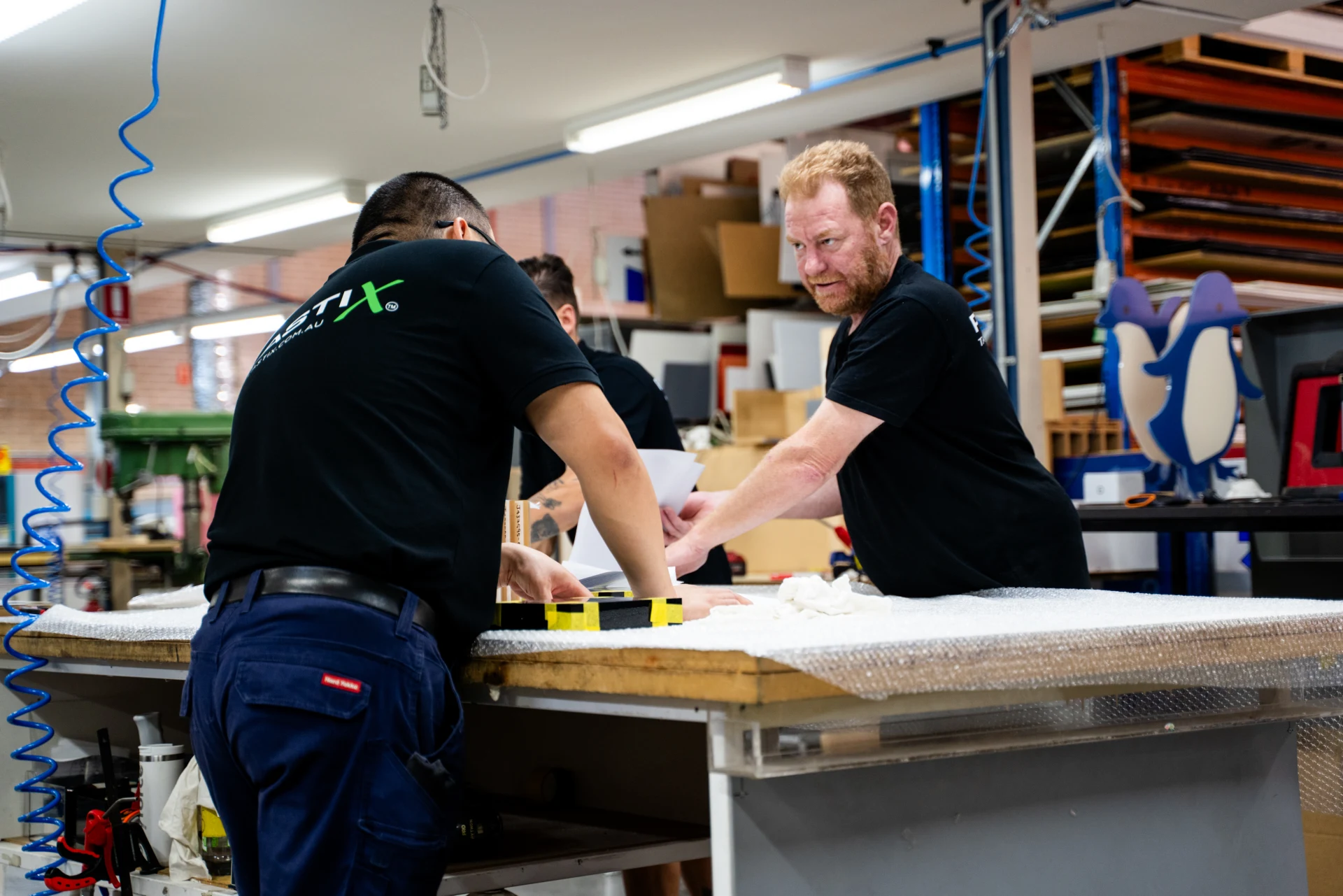 Plastix workshop team reviewing a customer job